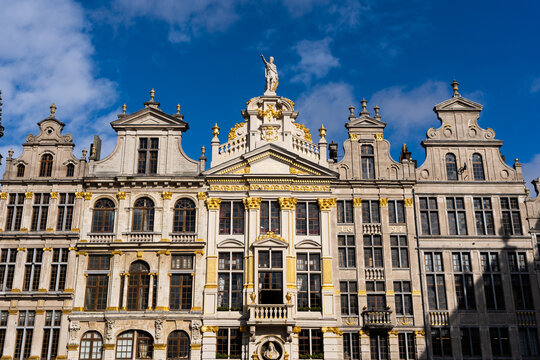 View of the ornate guildhalls with golden details and intricate stone facades in the historic Grand Place square in Brussels, Brussels, Belgium.