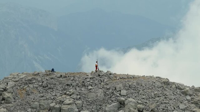 Drone Approach to Lone Hiker on Rocky Jezerca Ridge