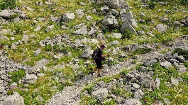 Aerial View of Lone Hiker on Rocky Mountain Trail in Albania