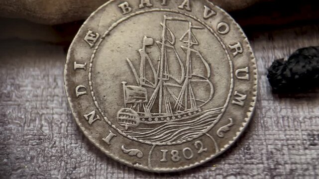 Front View of Antique 1 Gulden Batavorum Coin with Sailing Ship Macro Video
