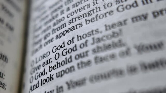 God of Jacob Bible scripture page slowly opening macro close up Christian faith religious text