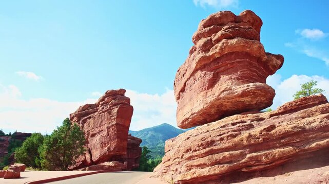 Warm sunrise light highlights eroded sandstone textures on the famous perched monolith at Garden of the Gods Park Colorado