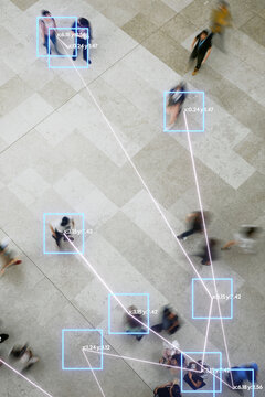 People Walking in Busy Area With Data Overlays in Urban Setting