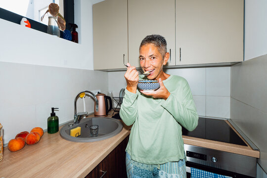 Eating from a bowl at home