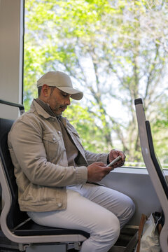 Man using his smartphone inside a train in the Netherlands