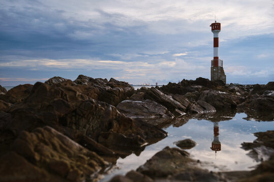 lighthouse on a rocky beach