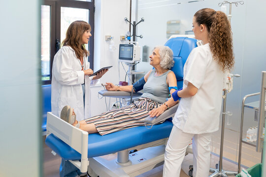 Healthcare professionals caring for elderly patient in clinic