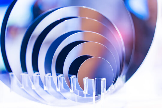 Wafers of different sizes (in inches) for manufacturing semiconductor of integrated circuit.Electronic circuit designs have been built onto the wafers using micromaching including photolithography