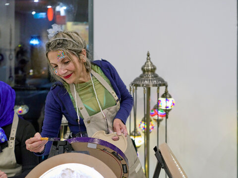 Senior Woman Attends an Art Workshop in the Evening