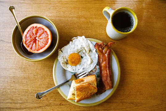 Plate of breakfast foods on the kitchen table