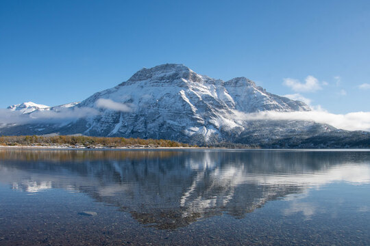 Vimy Peak reflected in Waterton Lake on a sunny autumn day, Waterton Lakes National Park, Alberta, Canada