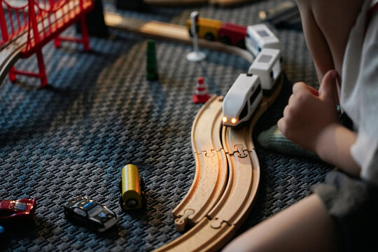 Close-Up of a Toy Train and Cars on a Carpet