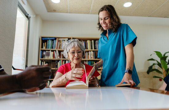 Elderly Care Home Staff and Patients in Rehabilitation and Swimming Po
