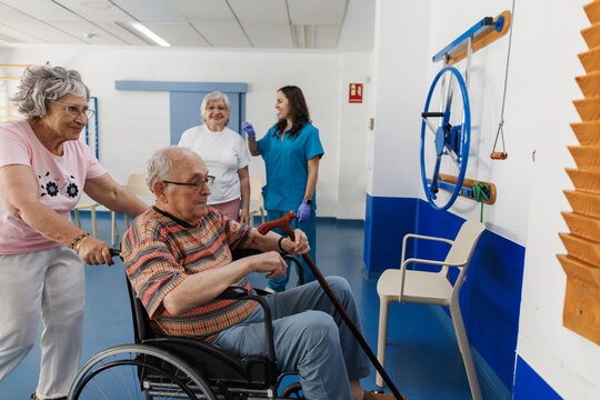 Elderly people engaging in physiotherapy rehabilitation with