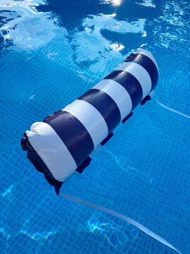 Striped pool floater floating in the clear water