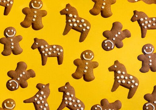 Homemade Gingerbread Cookies Making Pattern on a Yellow Background