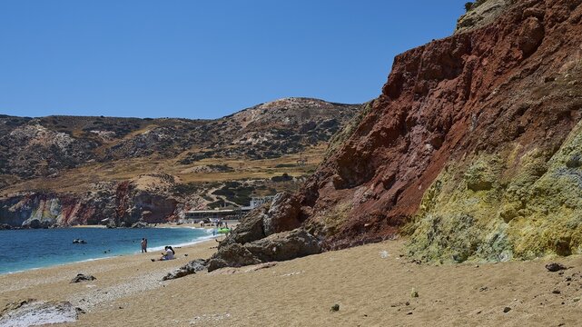 View of colorful cliffs on a beach with clear sky, Paliochori beach, Paliochori, volcanic rock, copper, nickel, mineral salts, volcanic island, Milos, Cyclades, Greek islands, Greece