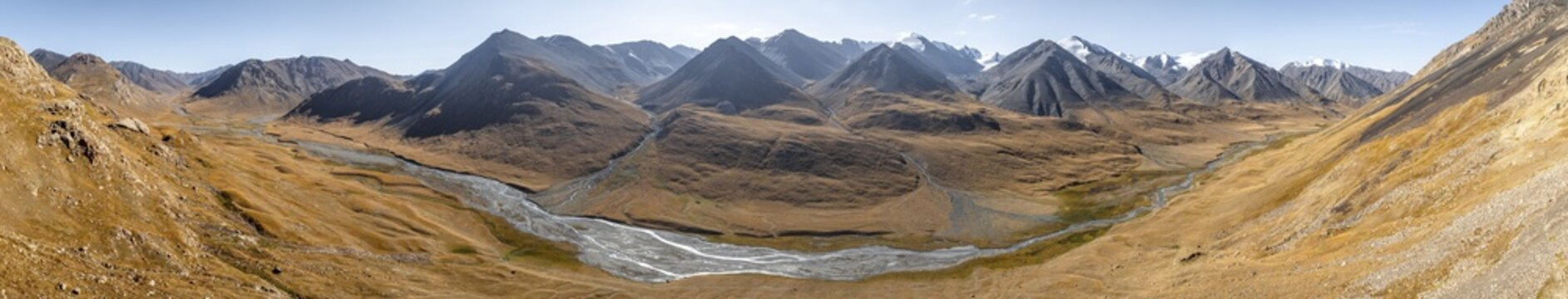 Aerial view, Burkhan mountain valley with meandering river, barren dramatic mountain landscape, Terskey Ala-Too, Tien Shan, Issyk Kul province, Kyrgyzstan