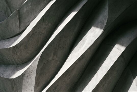 Abstract concrete texture with futuristic diagonal wave relief, modern parametric architecture background.