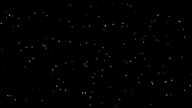 Golden stardust and faint blue bokeh twinkling on black space