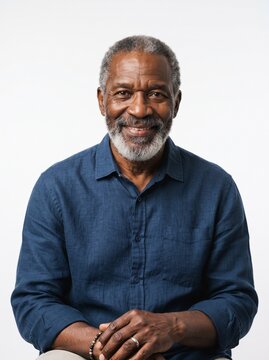 Portrait of a mid aged dark-skinned man isolated in a white background with copy space, Charming handsome mid age man professional profile picture. studio lighting, friendly and confident expression