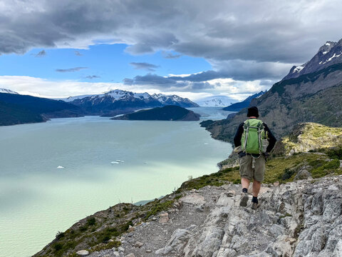 Rear view of a Man hiking on the W Circuit at Grey Glacier Lookout, Torres del Paine National Park, Chilean Patagonia, Chile