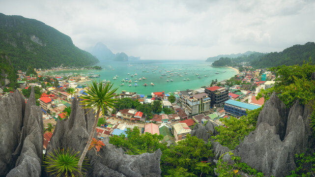 Aerial view of El Nido Town and Bacuit Bay from Taraw Cliff on an overcast day, Palawan, Philippines
