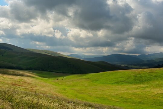 Moody sky over rolling green hills and meadows on a  summer day, Mt Zlatibor, Serbia
