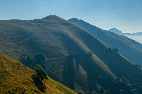 Hazy layered mountain landscape at dusk, Lombard Prealps, Italy