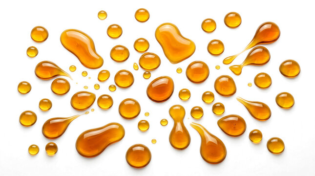 Honey drops splatter and flowing golden syrup liquid splashes isolated on transparent background