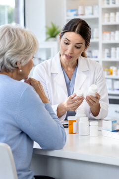 Clinical pharmacist counsels senior patient about safe medication use, reviewing dosage timing, drug interactions, adherence and prescription safety during pharmacy consultation.