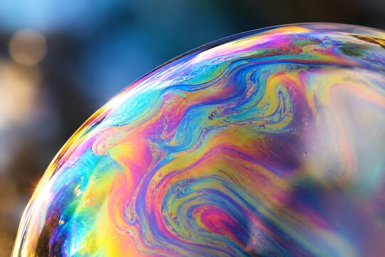 Macro shot of a colorful iridescent soap bubble surface
