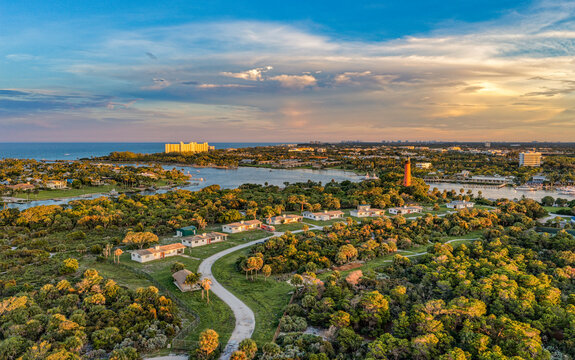 aerial view at sunset of Jupiter Inlet and Jupiter Lighthouse