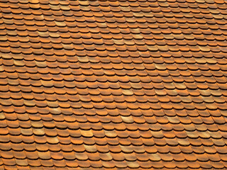 Seamless orange beaver tail roof tile pattern background texture of traditional clay rooftop surface © Sergio Grisaldi