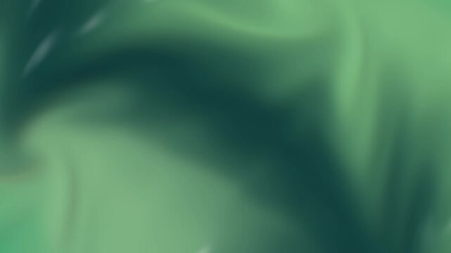 Abstract green motion background video featuring soft flowing liquid silk waves creating elegant shimmering light effects for modern graphic design projects and digital presentations