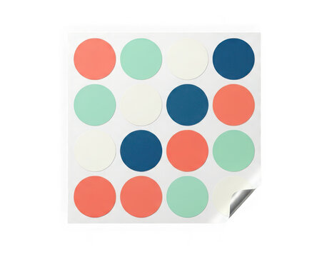 Sheet of colorful round adhesive stickers in coral, mint, cream, and dark blue, organized in a grid pattern isolated on transparent background