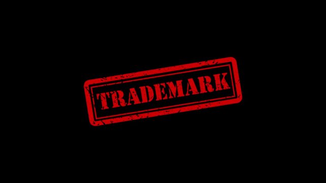 Trademark red rubber stamp effect on black background, for intellectual property, and branding concepts