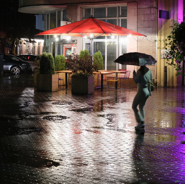 Rain and lights, reflexes of the evening city.