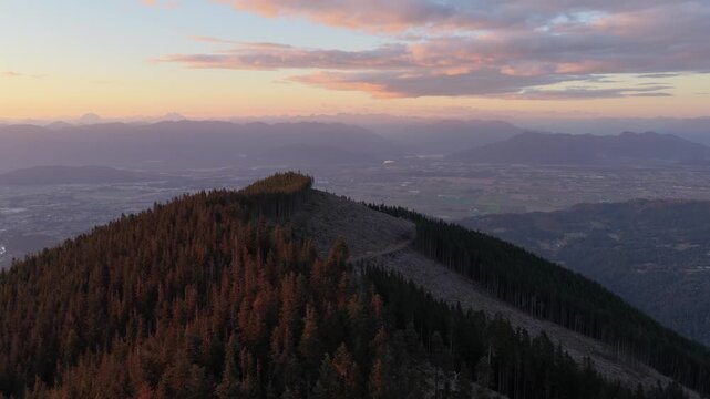 Majestic Sunset Over Chilliwack Mountain Ridge with Forest and Clear-Cut Areas in British Columbia, Canada