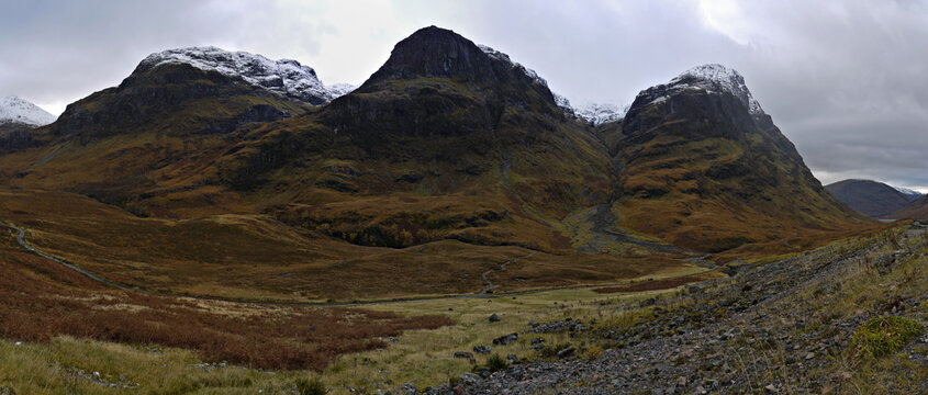 Autumn view of the Three Sisters of Glencoe in the highlands of Scotland, showing Beinn Fhada, Coire Gabhail, Gearr Aonach, Coire nan Lochan and Aonach Dubh.