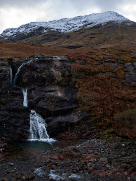 Waterfall below Stob Coire Raineach, the northern munro peak of Buachaille Etive Beag. Glencoe, Highlands of Scotland.
