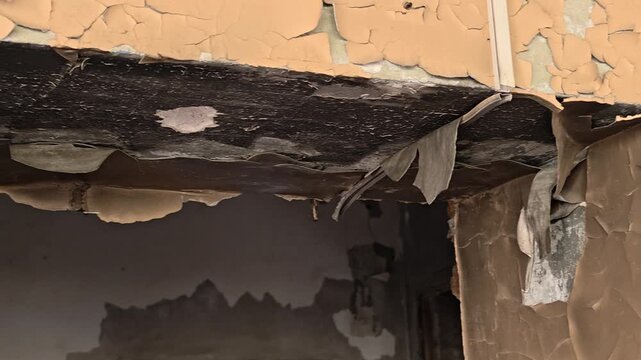 A close-up view of peeling paint on a wall,