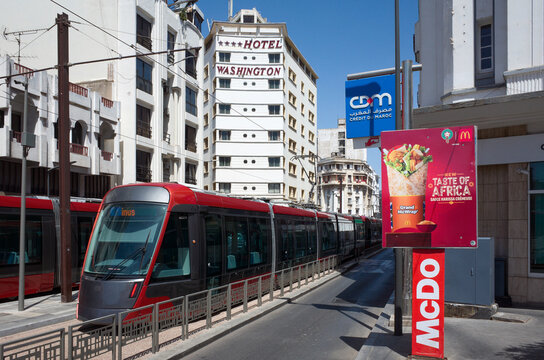 Casablanca, Morocco &ndash; July 17, 2025: Tram near HOTEL WASHINGTON with McDonald's ad - urban energy meets global branding
