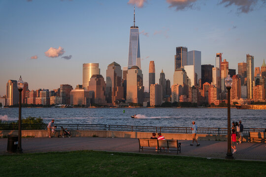 Walkers on the promenade of Liberty State Park at the end of the day, Jersey City, New Jersey, United States