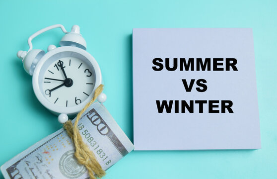 Concept of summer vs winter write on sticky notes isolated on table.