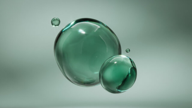 Large and small teal water droplets suspended in air