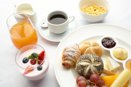 Continental breakfast spread with fresh fruit and pastries