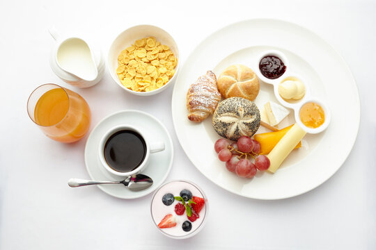 Healthy continental breakfast spread with coffee and juice