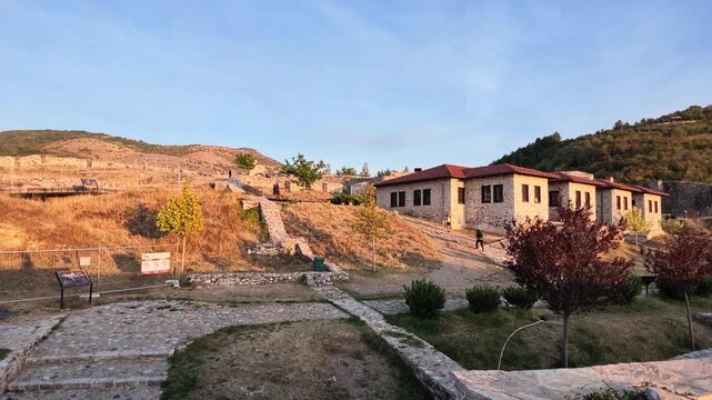 stone buildings and red-tiled roofs of the prizren fortress in kosovo at sunset