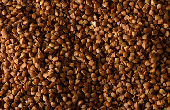 Close-up abstract pattern of raw organic buckwheat grains